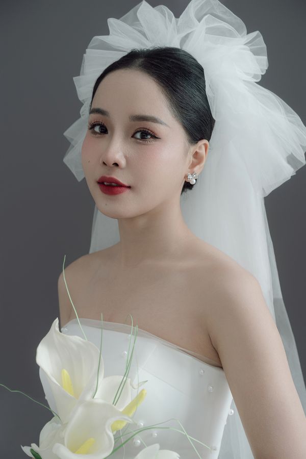 The Hoan Kiem Ruffle Crown Short Veil, photographed in Vietnam